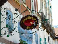 The decorative carved sign for the Cheesemonger's Shop