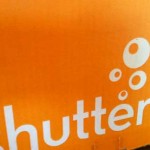 The bright orange packaging of a Shutterfly delivery